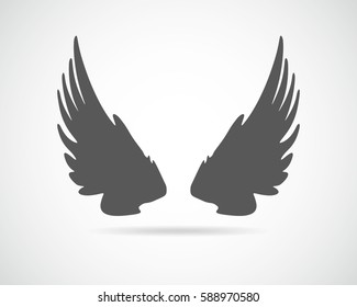 Gray winged icon. Silhouette of the wings, isolated on light background. Vector illustration.