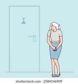 Gray-haired elderly woman stands alone in front of a toilet door, looking uncomfortable. She needs to go urgently