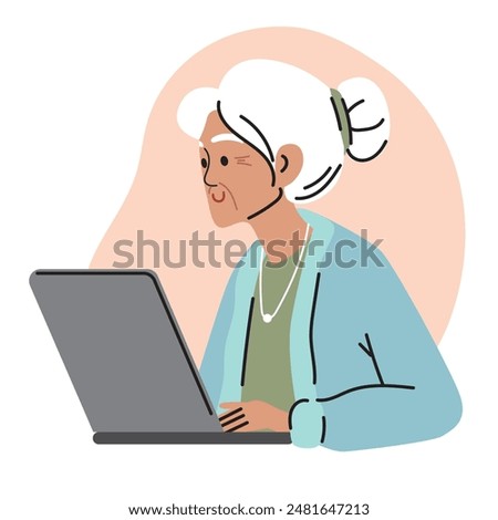 Gray-haired elderly woman works at laptop. An old woman is sitting at computer and surfing the Internet. Digitalization of the older generation