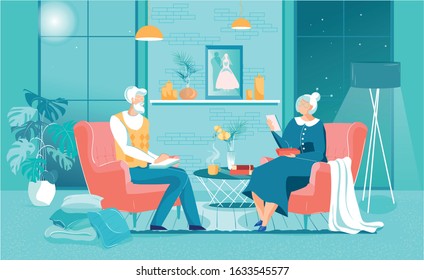Gray-haired Husband and Wife Review Family Album. Couple is Sitting in Living Room and Recall Events Past. On Table are Photo Albums and Hot Tea. In Soft Chairs they Comfortable Spend Time Together.