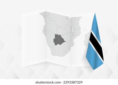 A grayscale map of Botswana with a hanging Botswanan flag on one side. Vector map for many types of news. Vector illustration.