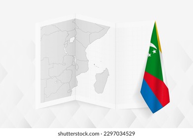 A grayscale map of Comoros with a hanging Comoros flag on one side. Vector map for many types of news. Vector illustration.