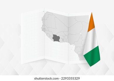 A grayscale map of Ivory Coast with a hanging Ivorian flag on one side. Vector map for many types of news. Vector illustration.