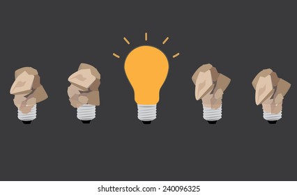 great idea concept with crumpled paper and light bulb on dark gray