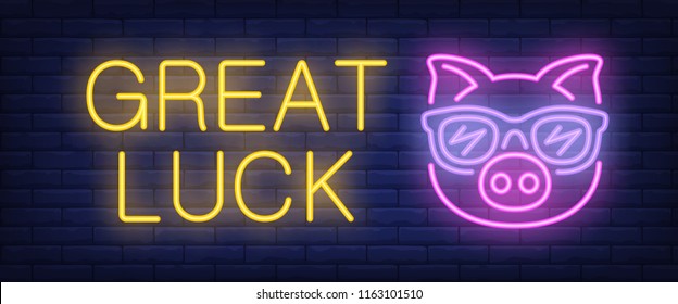 Great luck neon text with pig in glasses. Gambling, New Year day and Christmas design. Night bright neon sign, colorful billboard, light banner. Vector illustration in neon style.