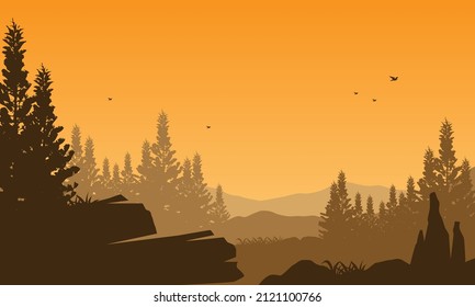 Great mountain view at dusk from the village with the silhouettes of the surrounding trees