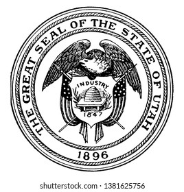 The Great Seal of the State of Utah, 1896, this circle shape seal has eagle holding shield, shield has beehive, INDUSTRY 1847 is written on shield, it has an American flag on each side of shield