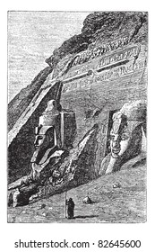 The Great Temple at Abu Simbel in Egypt, during the 1890s, vintage engraving. Old engraved illustration of Great Temple at Abu Simbel with guard in front.  Trousset encyclopedia (1886 - 1891).