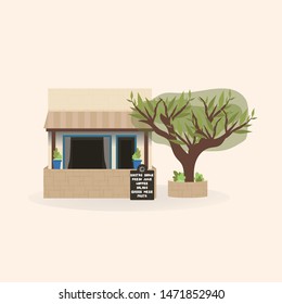 Greek cafe with an olive tree