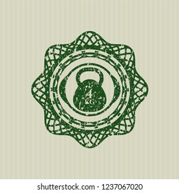 Green 4kg kettlebell icon inside distress rubber grunge seal