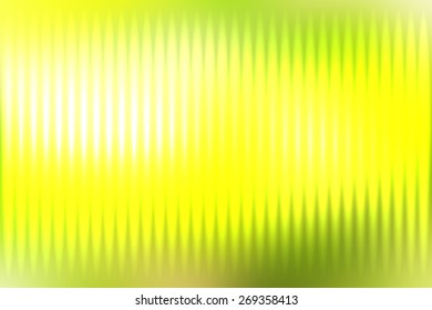 Green abstract blur colored background with defocused vertical rays of light.