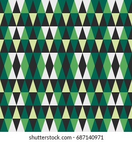 Green abstract geometric seamless pattern of triangles
