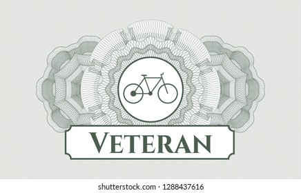 Green abstract linear rosette with bike icon and Veteran text inside