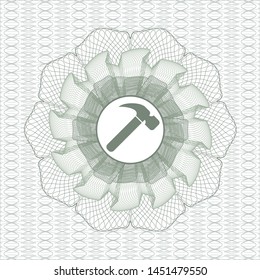 Green abstract linear rosette with hammer icon inside