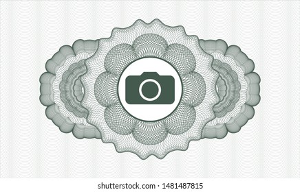 Green abstract linear rosette with photo camera icon inside