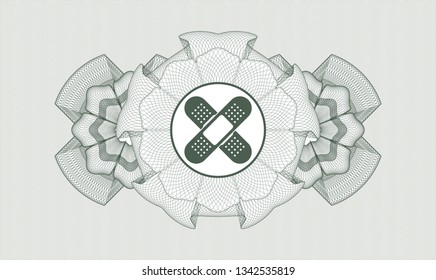 Green abstract rosette with crossed bandage plaster icon inside