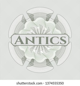 Green abstract rosette with text Antics inside