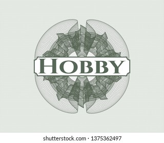 Green abstract rosette with text Hobby inside