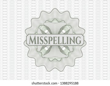 Green abstract rosette with text Misspelling inside