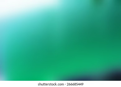 Green abstract smooth blur background for any design to put over.