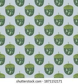 Green acorn doodle silhouettes seamless pattern. Light blue background. Nature print. Stock illustration. Vector design for textile, fabric, giftwrap, wallpapers.