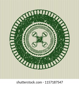 Green air drone icon inside distressed rubber stamp with grunge texture