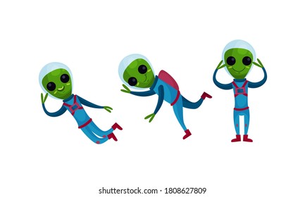 Green Alien Creatures in Spacesuit Standing and Waving Hand Vector Set