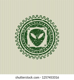 Green alien icon inside distress grunge stamp