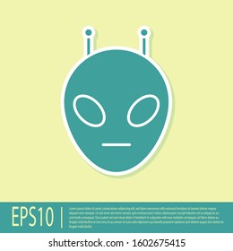 Green Alien icon isolated on yellow background. Extraterrestrial alien face or head symbol.  Vector Illustration