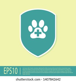 Green Animal health insurance icon isolated on yellow background. Pet protection icon. Dog or cat paw print. Vector Illustration