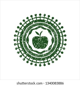 Green apple icon inside distress grunge seal