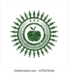 Green apple icon inside distressed rubber seal with grunge texture