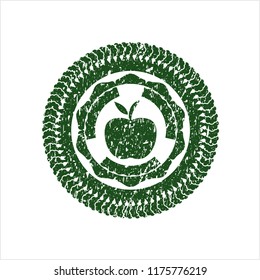 Green apple icon inside rubber texture