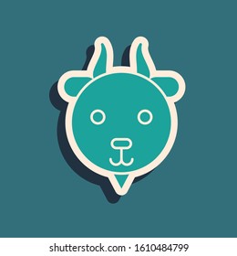 Green Aries zodiac sign icon isolated on blue background. Astrological horoscope collection. Long shadow style. Vector Illustration