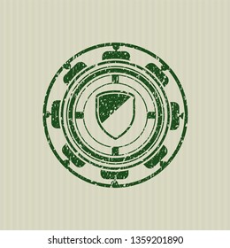 Green armor icon inside distress grunge style stamp