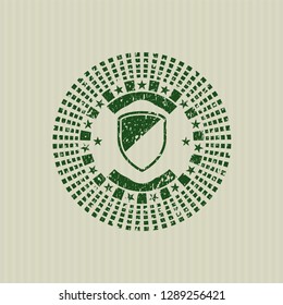 Green armor icon inside distressed rubber texture