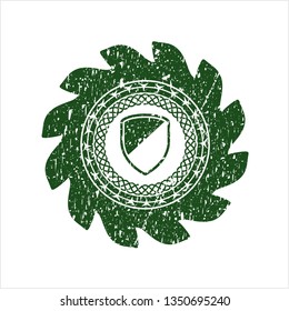 Green armor icon inside distressed grunge style stamp