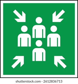 Green assembly point sign indicating a safe gathering area for individuals during emergencies.