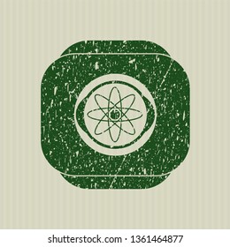 Green atom icon inside distress grunge stamp