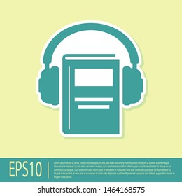 Green Audio book icon isolated on yellow background. Book with headphones. Audio guide sign. Online learning concept.  Vector Illustration
