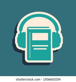 Green Audio book icon isolated on blue background. Book with headphones. Audio guide sign. Online learning concept. Long shadow style. Vector Illustration