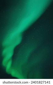 Green aurora borealis. Night starry sky and Northern lights
