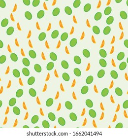 Green avocado and orange orange slice arranged in random order