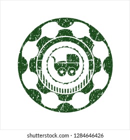 Green baby cart icon inside distressed grunge seal