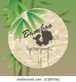 Green background with a crumpled paper round and bamboo stems and leaves. Vector illustration