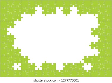 Green background from separate pieces of mosaic (puzzles) on a white background. Business, merger, joining, teamwork. 