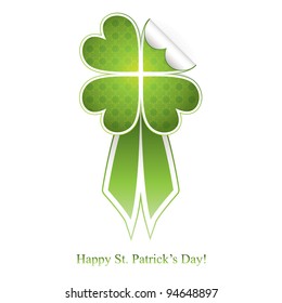 Green badge with clover and ribbon to St. Patrick's Day