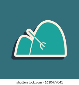 Green Bale of hay and rake icon isolated on blue background. Long shadow style. Vector Illustration