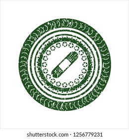 Green bandage plaster icon inside grunge seal