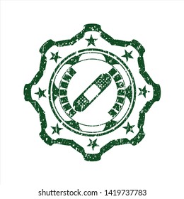 Green bandage plaster icon inside distressed rubber texture